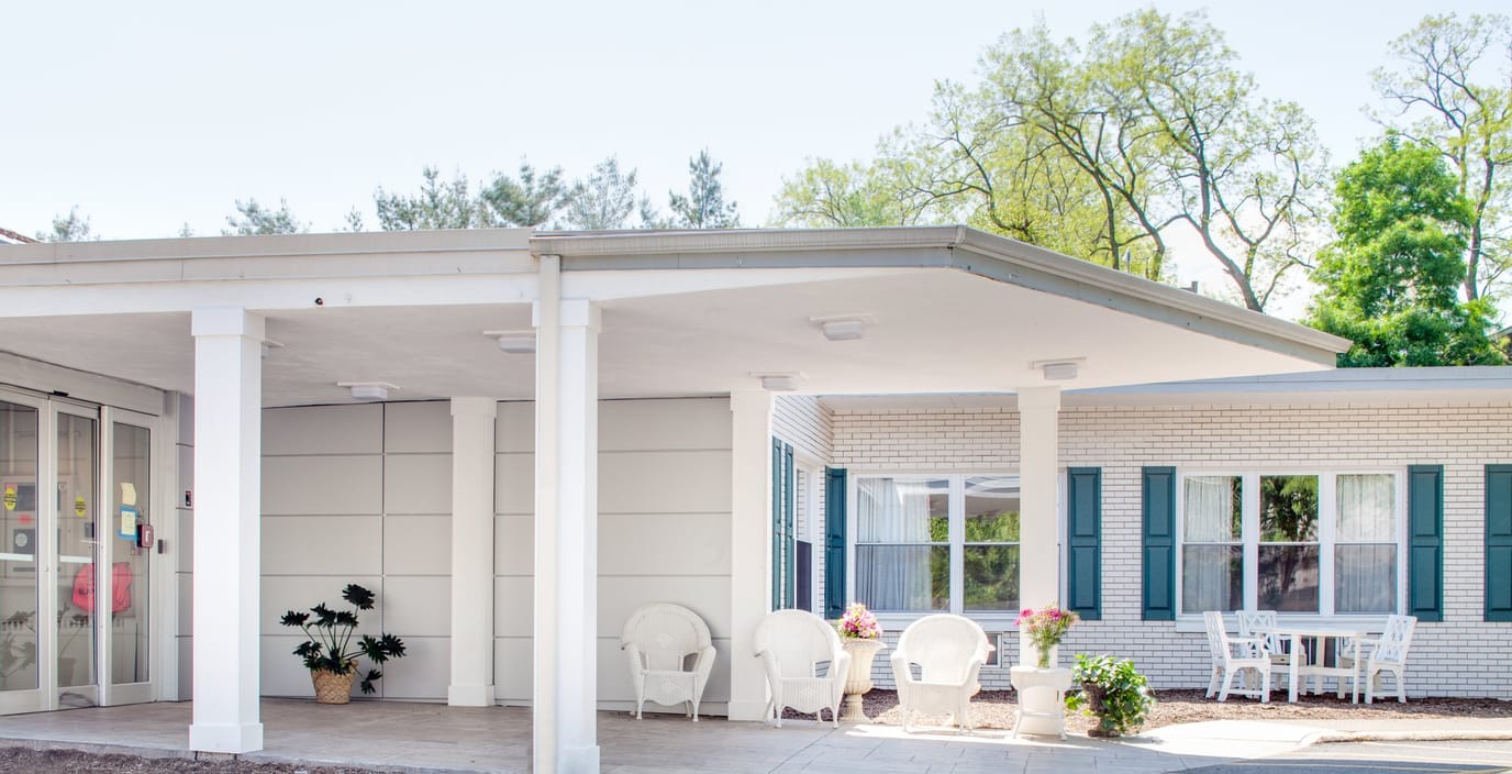 Exterior view of Maple Glen Center with outdoor seating