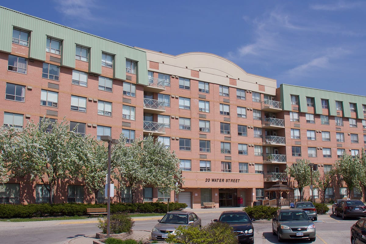 Exterior view of Cedarcrest Manor with flowering trees