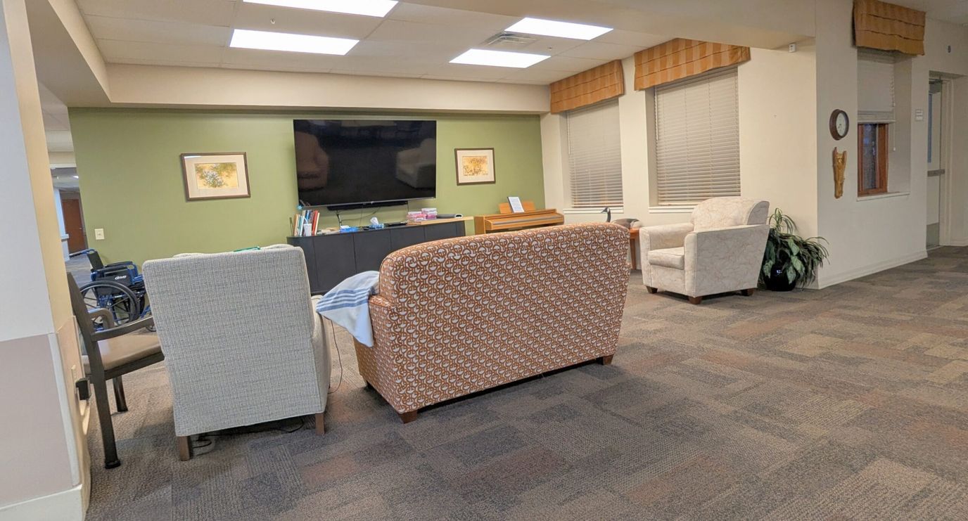 Common area with seating and TV