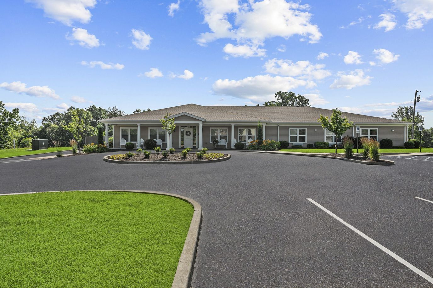 Exterior view of Harton Senior Living facility with landscaped entrance