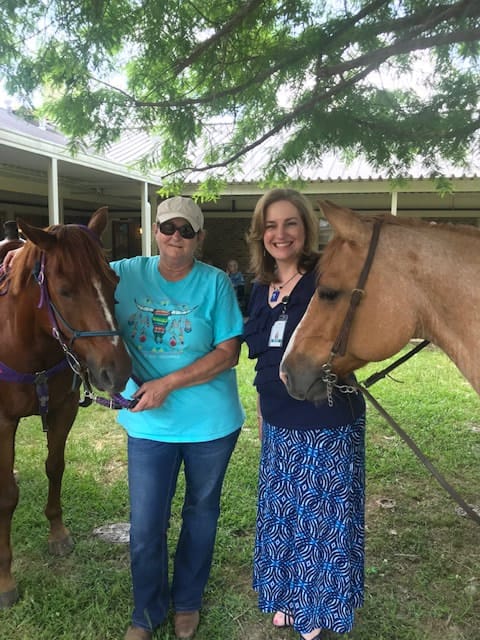 Residents enjoying time with horses outdoors