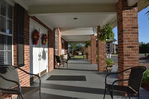 A welcoming porch area with seating and plants
