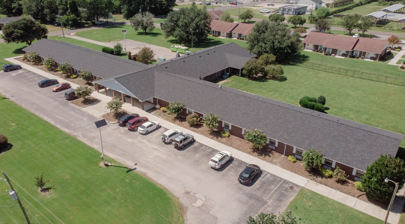 Aerial view of the Poplar Grove facility with parking and green space