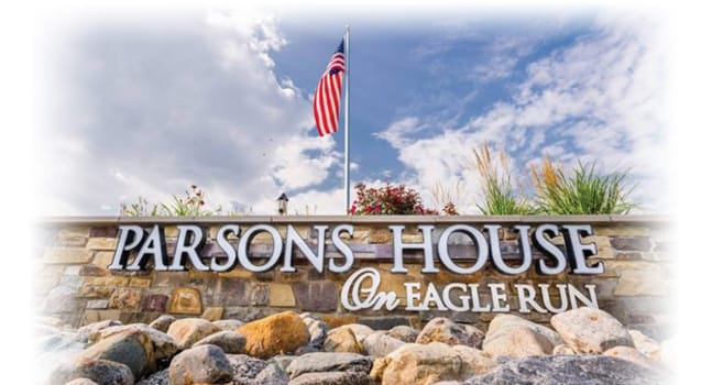 Sign with facility name in front of building