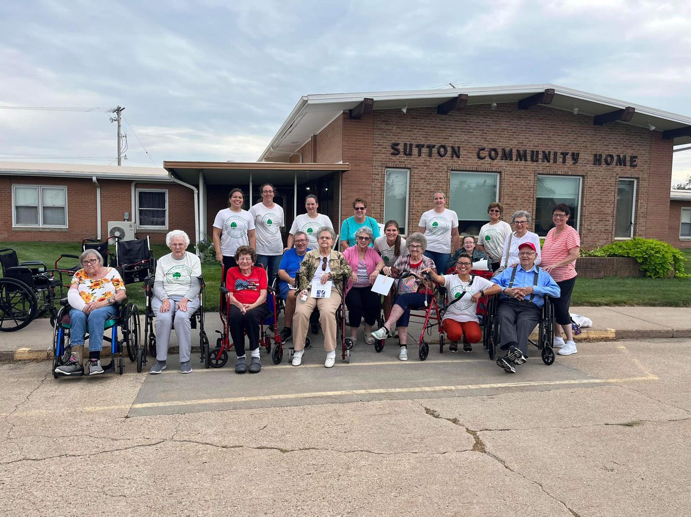 Group of residents and staff in front of Sutton Community Home