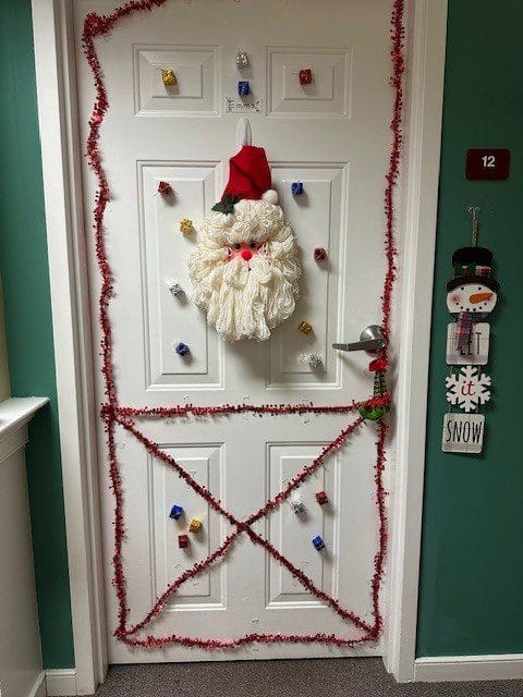 Festive holiday-themed door decoration.