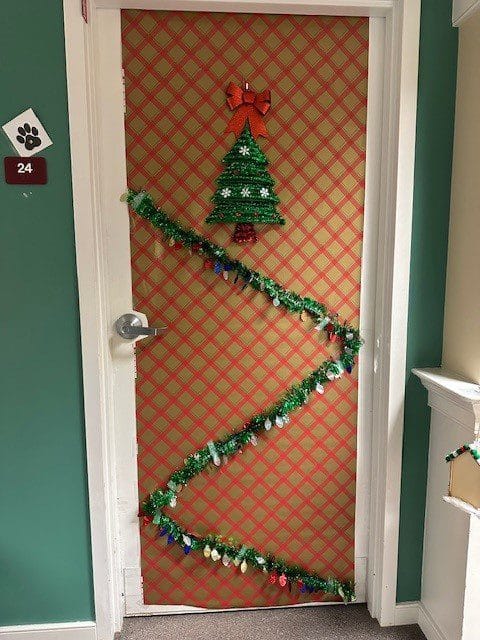 Decorated door with Christmas theme in a hallway