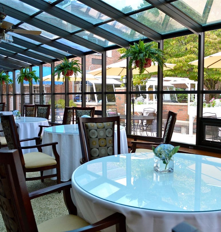 Bright dining area with tables and outdoor view.