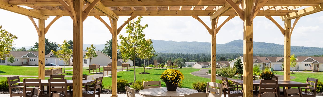 Outdoor patio area with seating and mountain view
