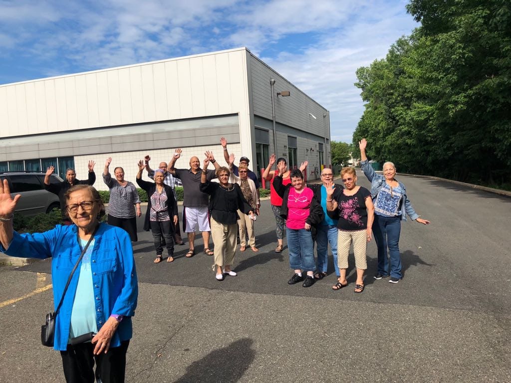 Residents waving outside the building