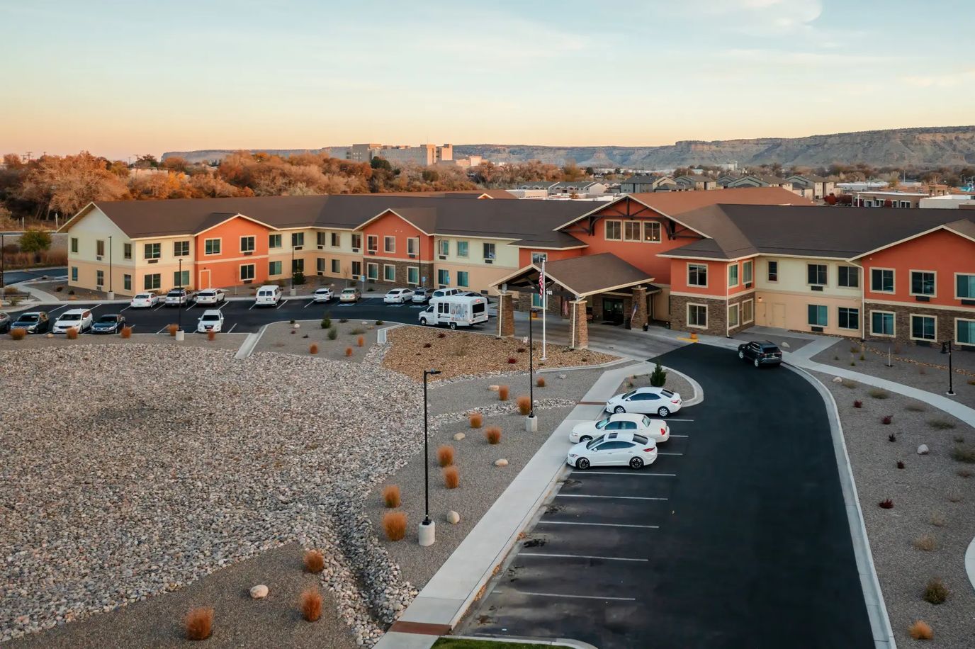 Aerial view of a senior living facility with landscaped grounds