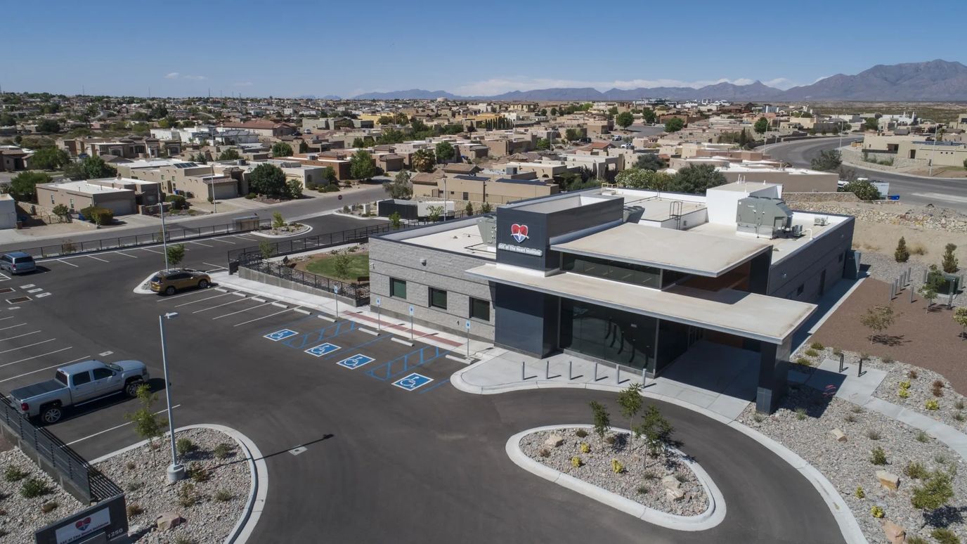 Aerial view of the facility building with parking area