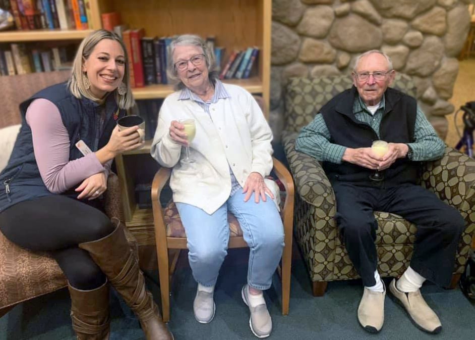 Residents enjoying drinks in a cozy common area