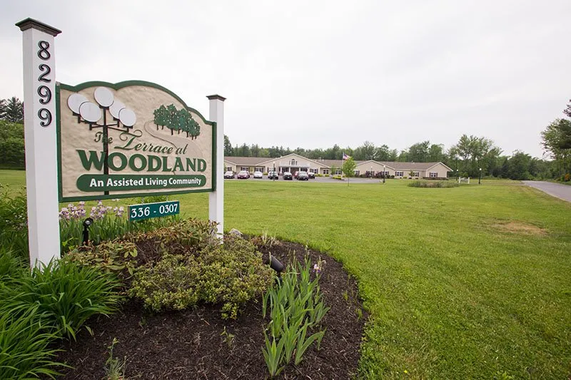 Exterior view of The Terrace at Woodland with sign