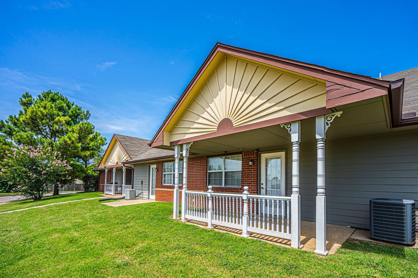 Exterior view of a senior living facility with a porch