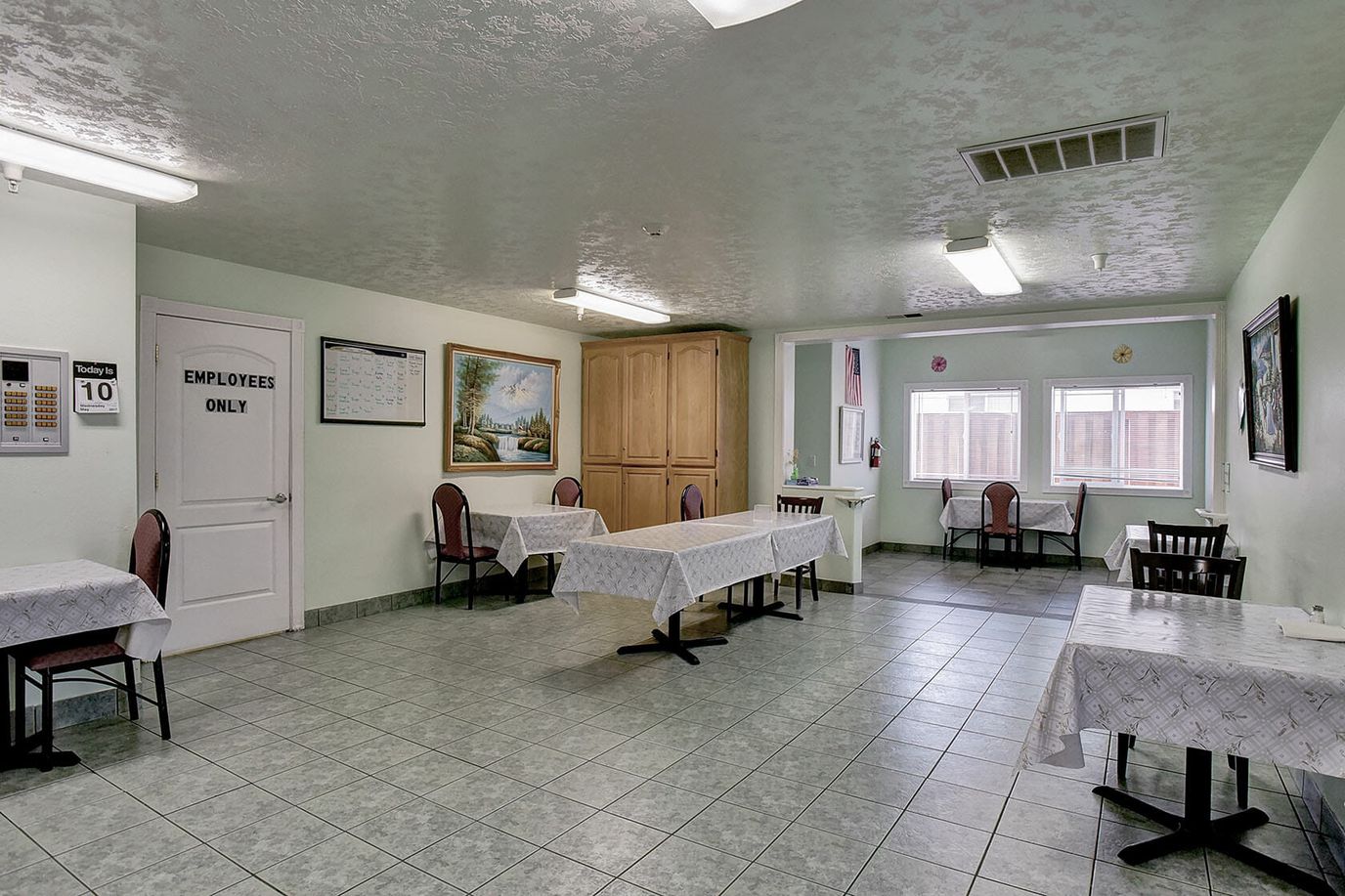 Bright common area with tables and chairs