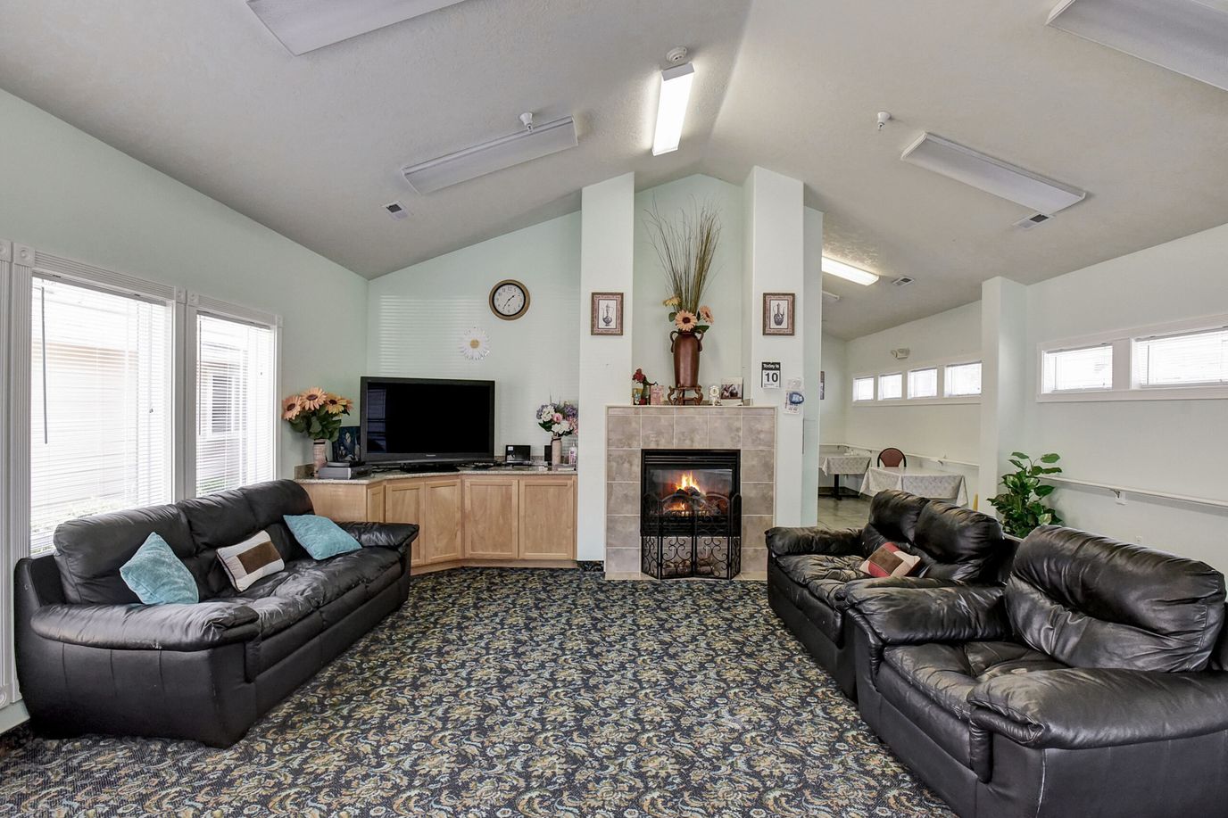 Cozy common area with comfortable seating and a fireplace