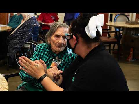Staff and resident engaged in conversation