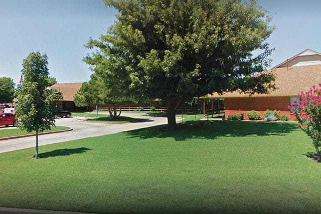 Bright outdoor view of landscaped grounds at the facility
