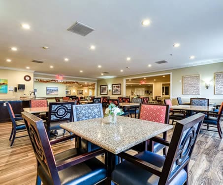 Bright dining room with tables and chairs
