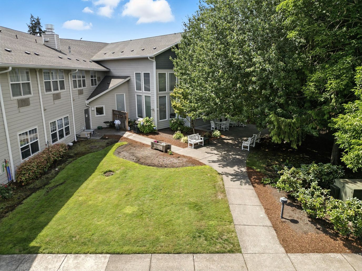 View of landscaped outdoor space at Cedar Village Assisted Living