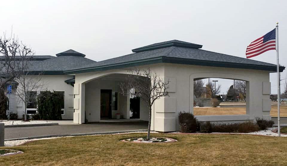 Entrance of Nyssa Gardens Assisted Living Facility with flag