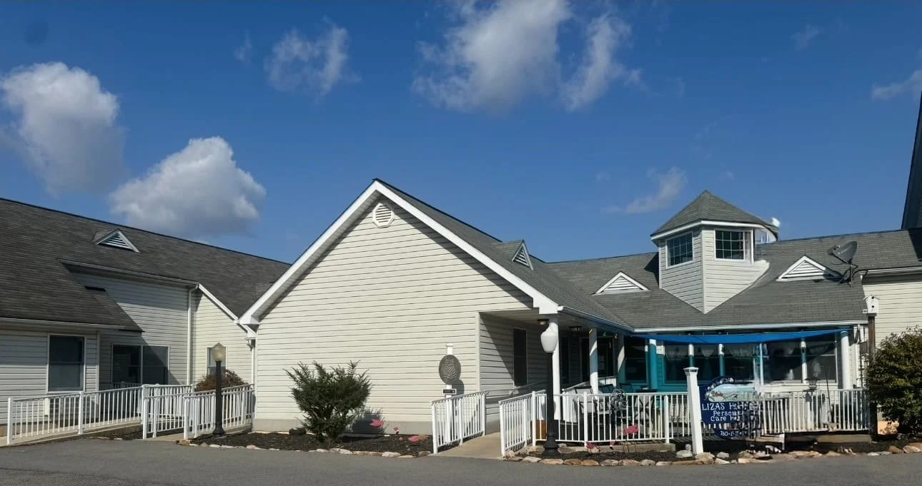 Exterior view of Liza's House with blue accents