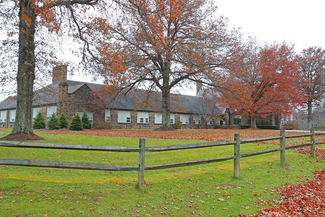 Exterior view of Greystone Country Estates surrounded by autumn trees