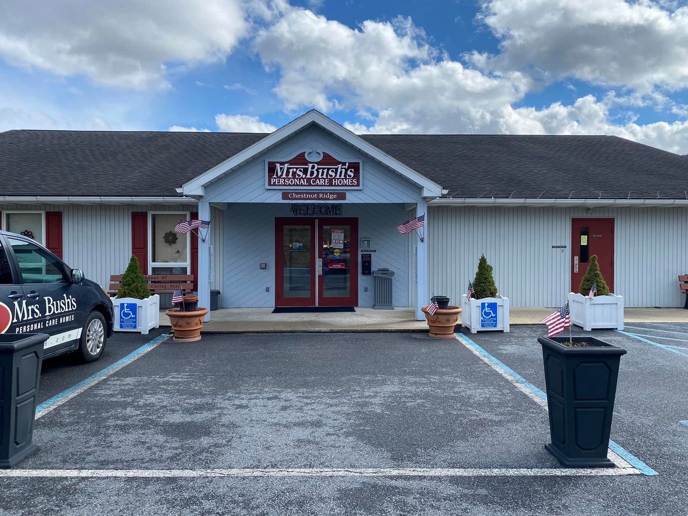 Entrance to Mrs. Bush's Personal Care Home with flags