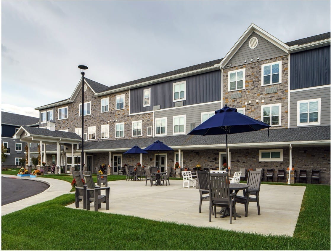 Outdoor seating area with umbrellas at the facility exterior