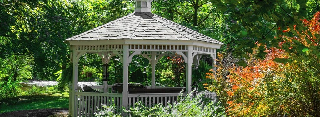 A gazebo surrounded by vibrant gardens
