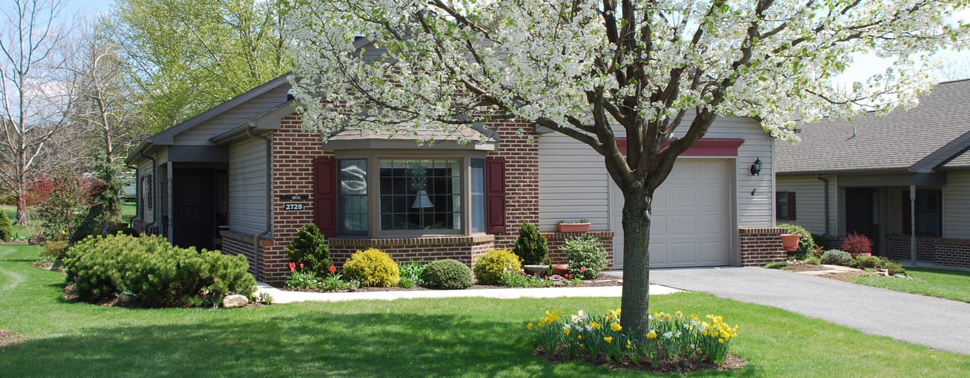 Exterior view of a residential building with flowers