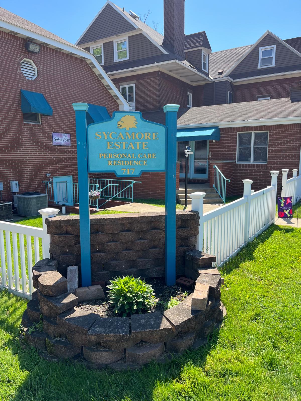 Exterior view of Sycamore Estate Personal Care Residence sign