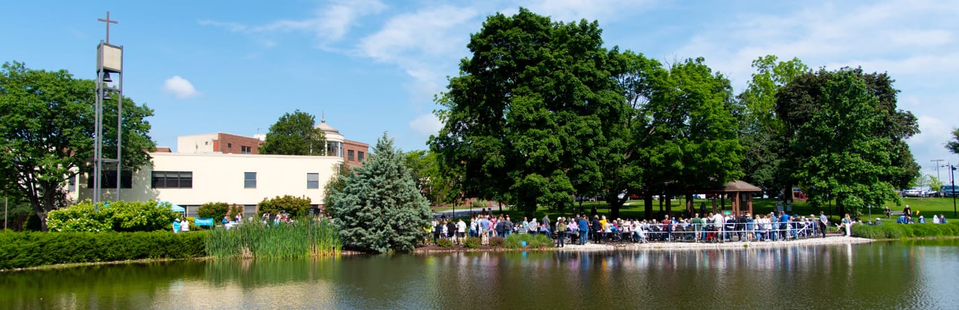 Residents enjoying a sunny day by the lake
