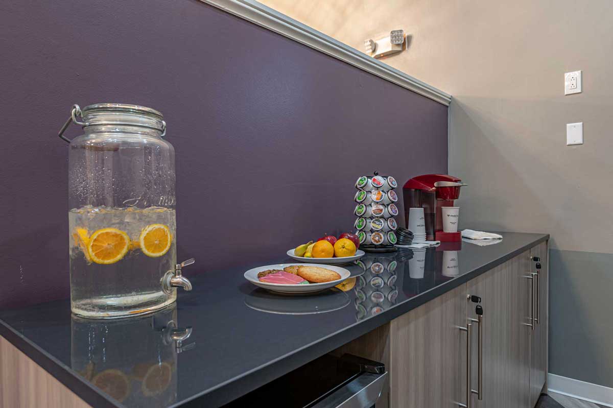 Beverages and snacks arranged on a counter