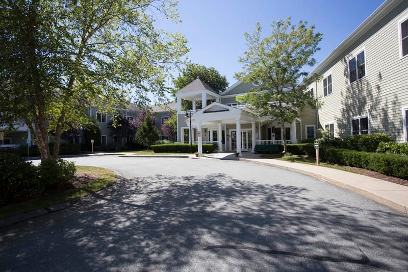 Entrance of an assisted living facility with landscaping