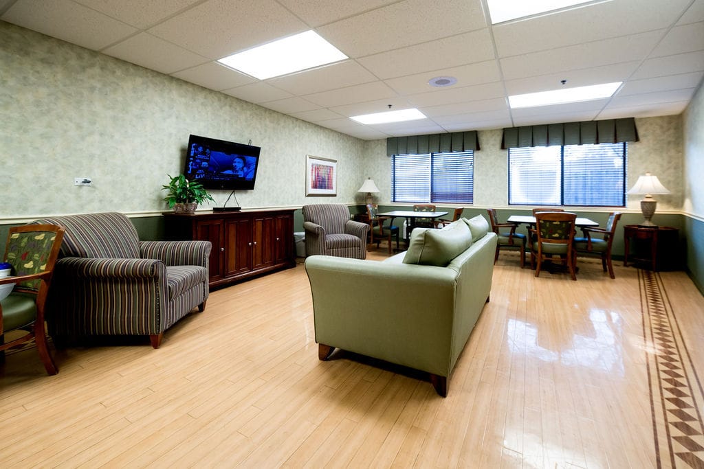 Interior lounge area with furniture and television