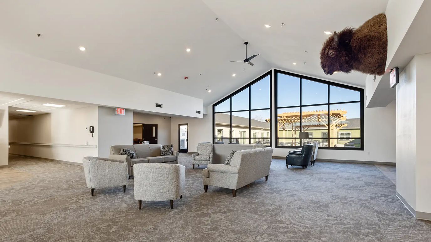 Interior common area with seating and large windows