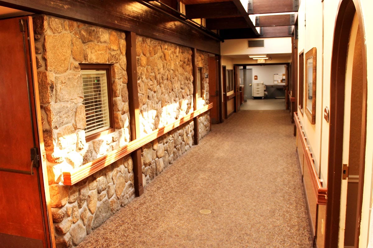 Interior hallway with stone wall and carpet