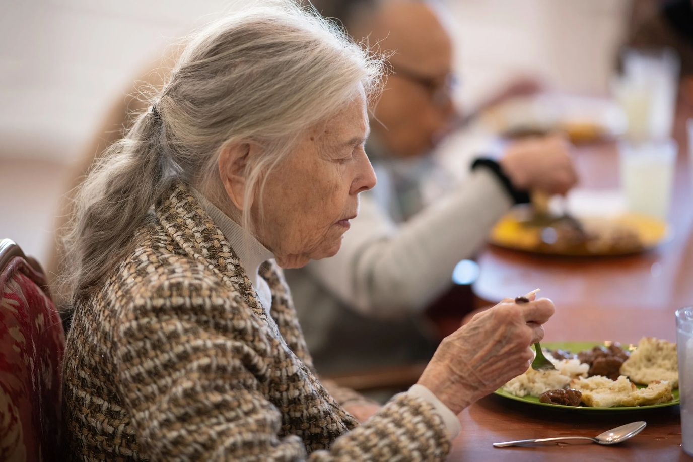 Residents enjoying a meal in the dining room.