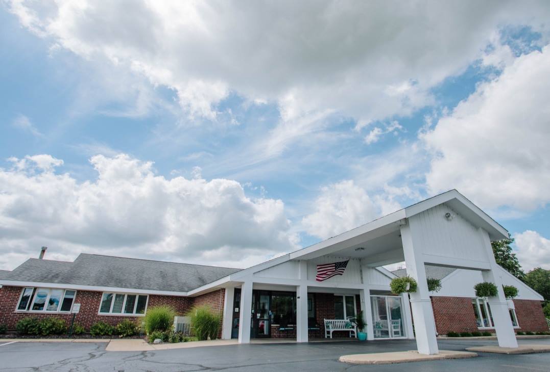 Exterior view of the facility with a covered entrance