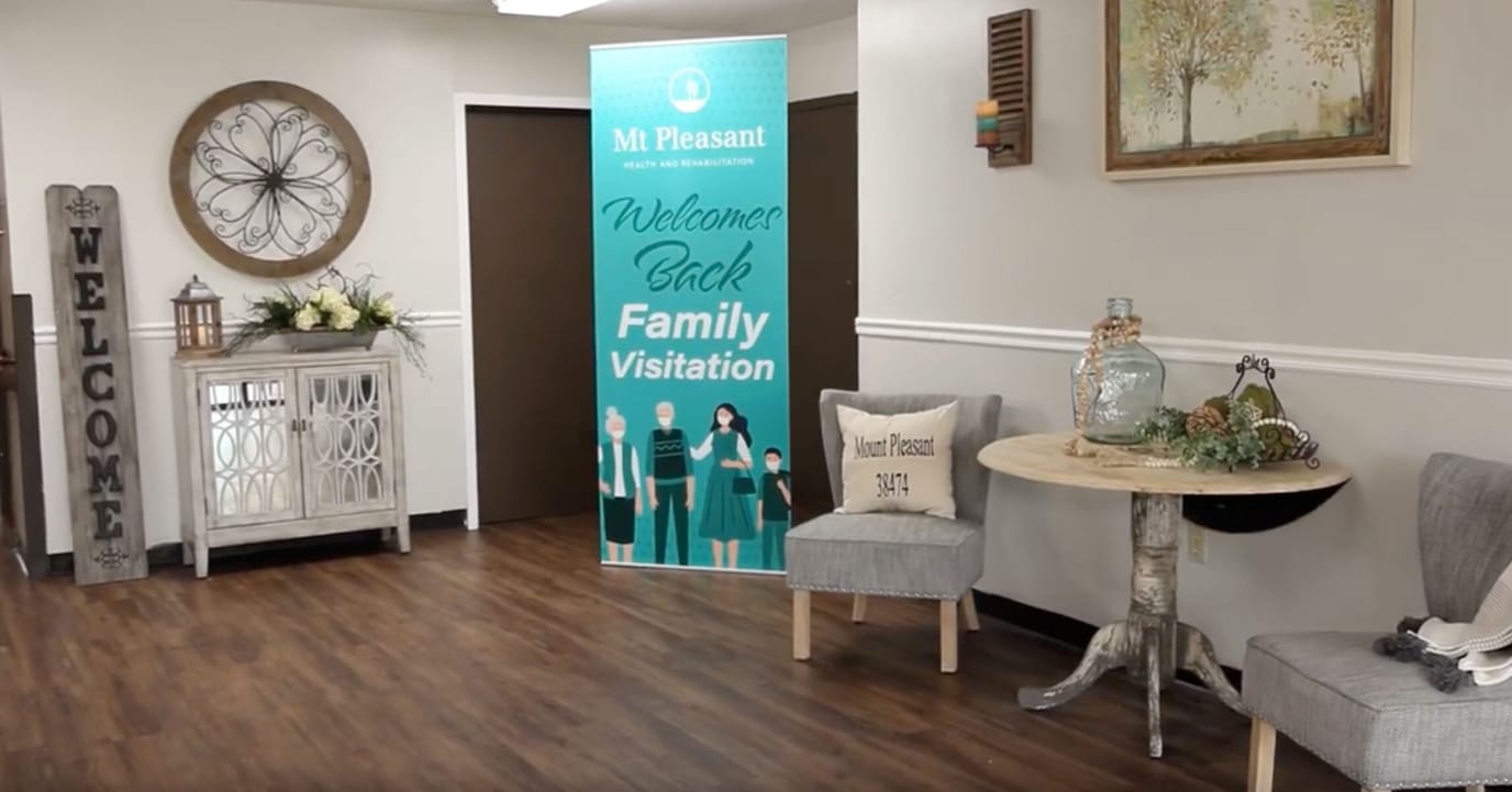 Bright lobby area with welcome sign and residents