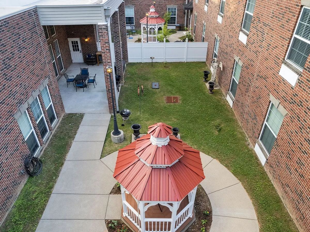 Aerial view of a gazebo in a grassy courtyard