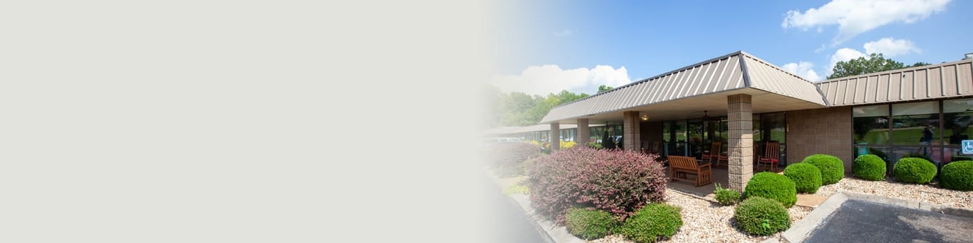 The exterior of Selmer Post Acute with lush landscaping