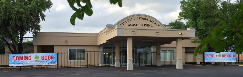 Exterior view of Vincent Victoria Village building with banners