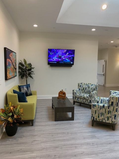 Cozy common area with seating and a TV