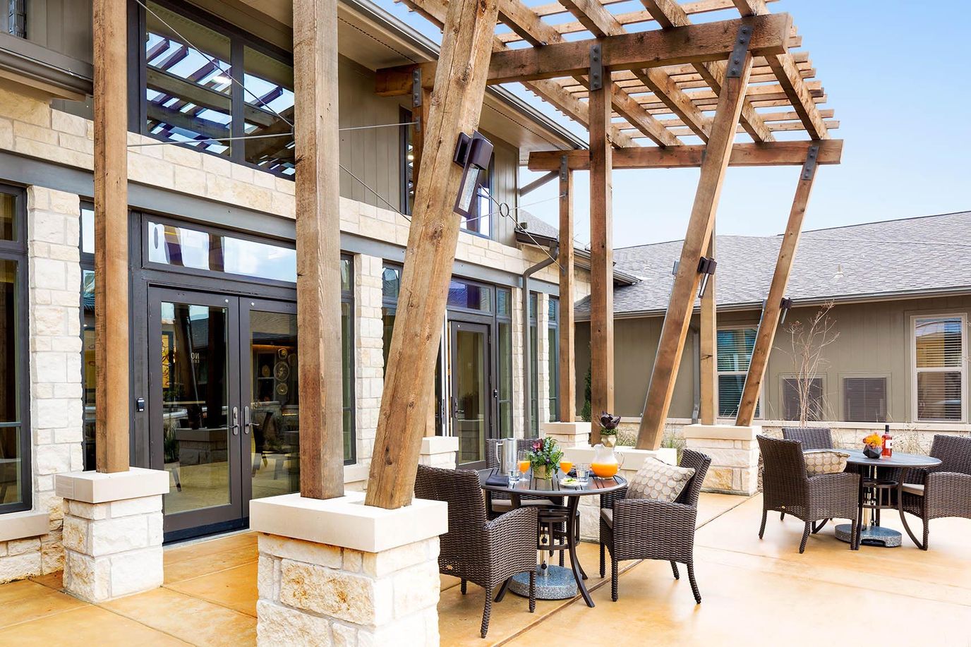 Outdoor seating area with tables and chairs