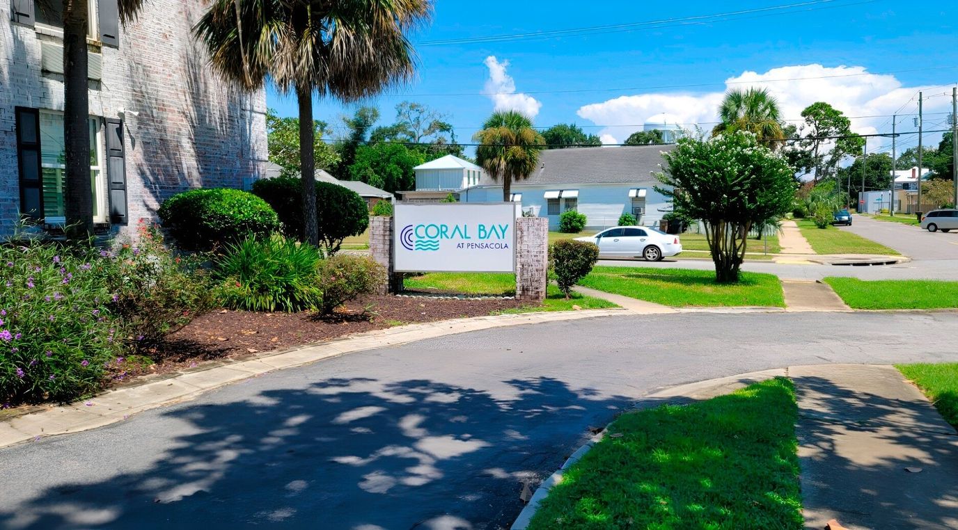 Entrance sign of Coral Bay at Pensacola