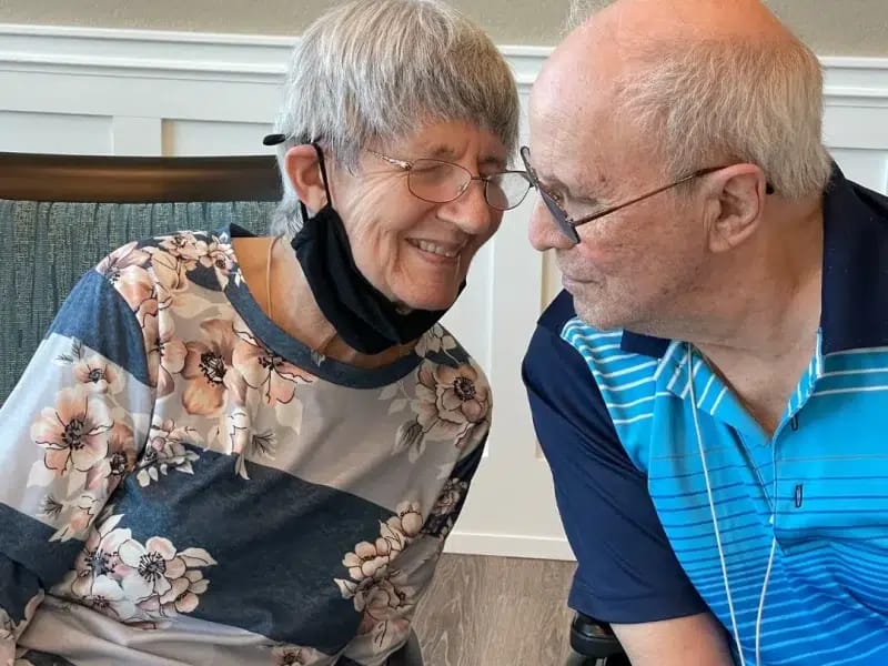 Residents sharing a joyful moment indoors
