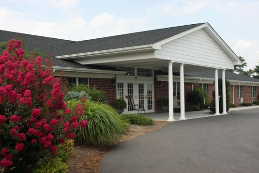 Exterior view of Shenandoah Place with flowers